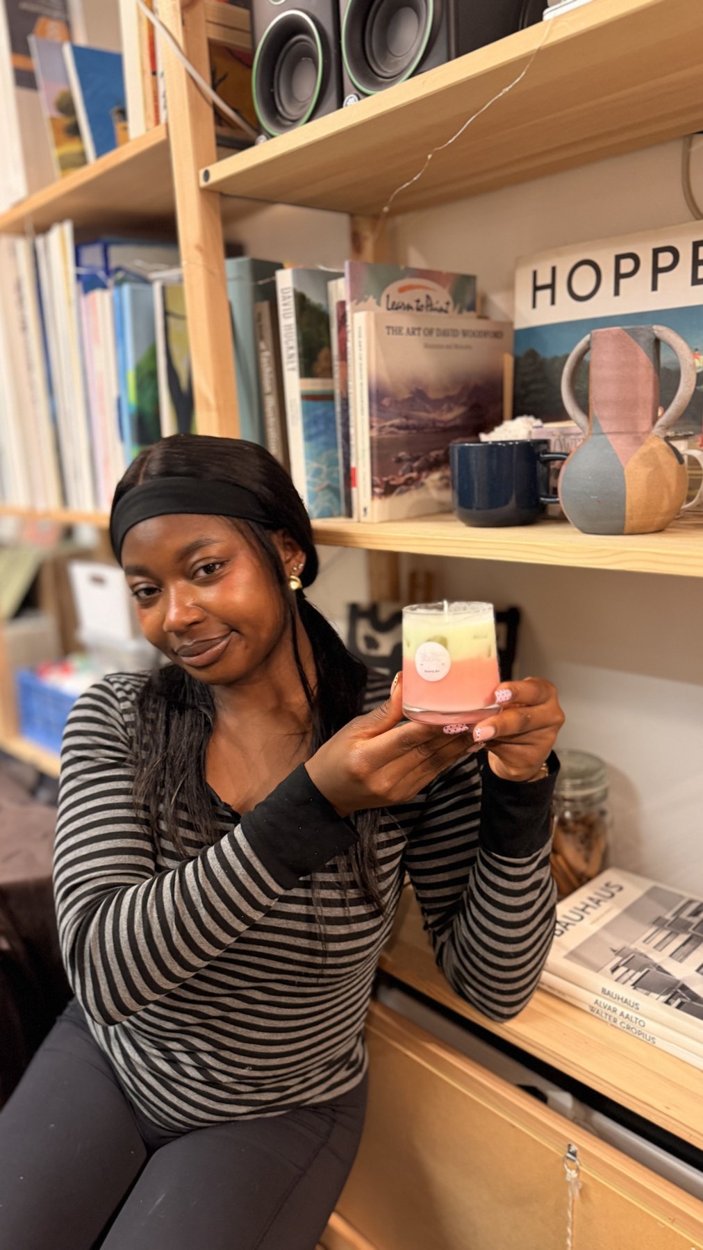 A guest holding her handmade candle