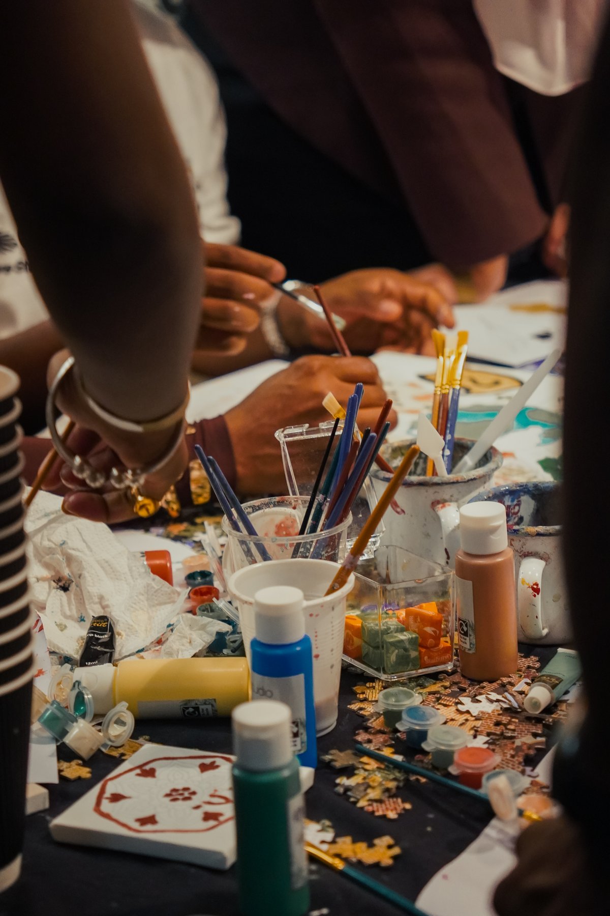 Paint brushes and colours on the table