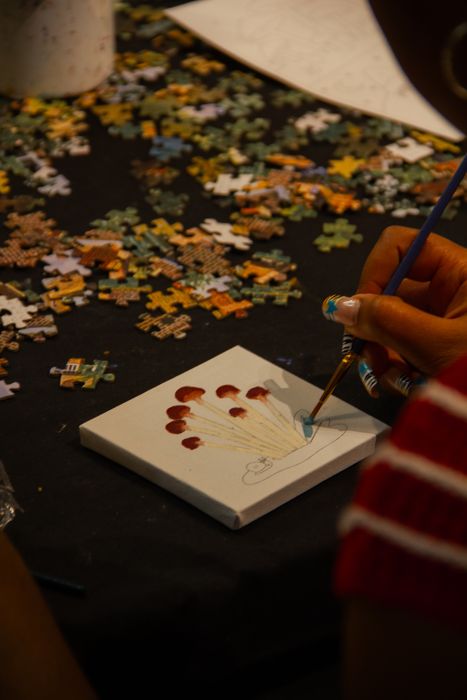 Painting beside a shared puzzle